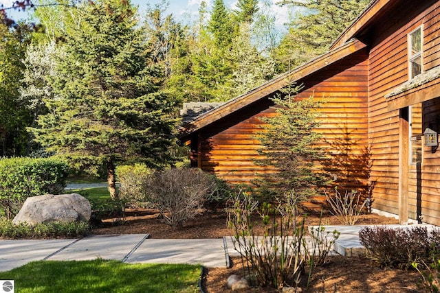 12150 N Seven Pines Rd, Northport, MI 49670 - view of home's exterior featuring a patio area