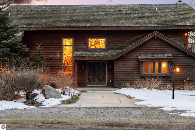12150 N Seven Pines Rd, Northport, MI 49670 - view of snow covered property entrance