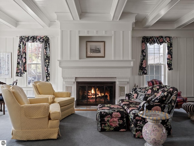 431 Michigan Ave, Charlevoix, MI 49720 - carpeted living room featuring beam ceiling, a brick fireplace, plenty of natural light, and crown molding