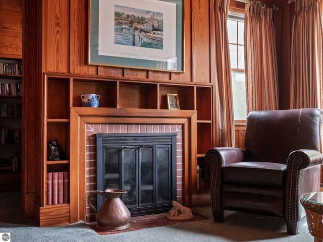 431 Michigan Ave, Charlevoix, MI 49720 - sitting room featuring a brick fireplace and carpet floors