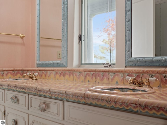 431 Michigan Ave, Charlevoix, MI 49720 - bathroom featuring double vanity