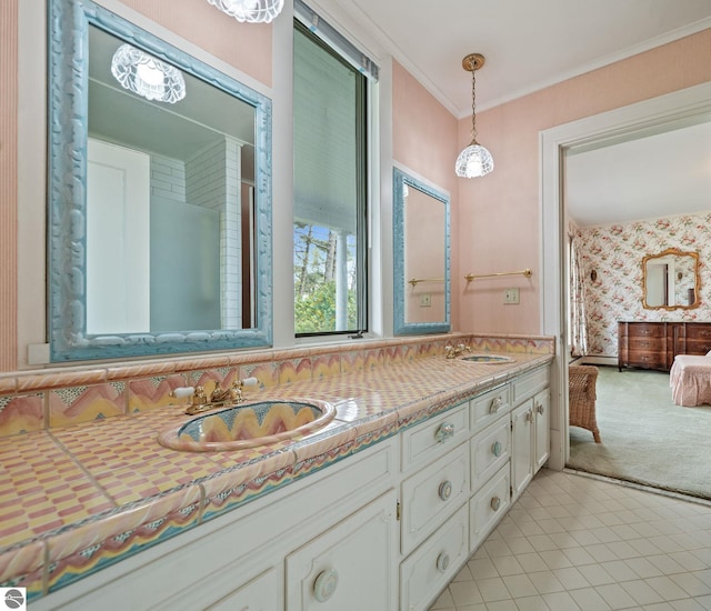 431 Michigan Ave, Charlevoix, MI 49720 - bathroom featuring double vanity, tile patterned floors, and crown molding