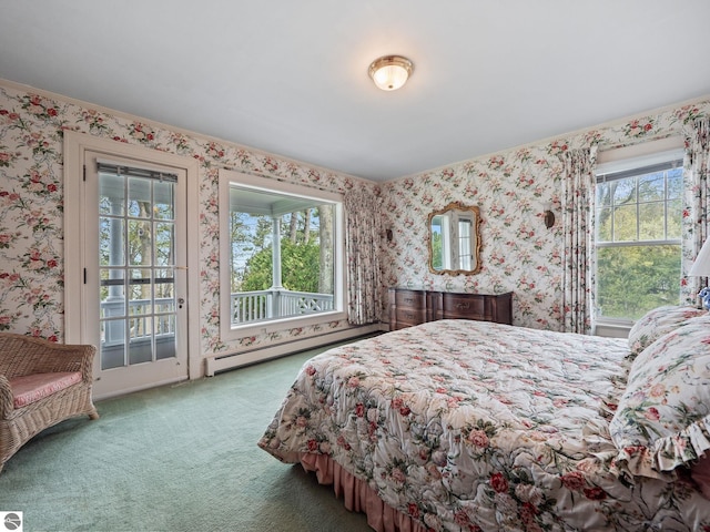 431 Michigan Ave, Charlevoix, MI 49720 - carpeted bedroom featuring baseboard heating, wallpapered walls, and access to outside