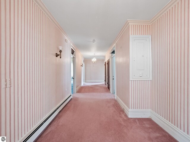 431 Michigan Ave, Charlevoix, MI 49720 - corridor featuring a baseboard radiator, carpet, a chandelier, and baseboards