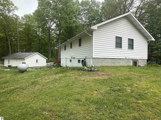 142 Forest Trl, Leroy, MI 49655 - view of property exterior featuring a lawn