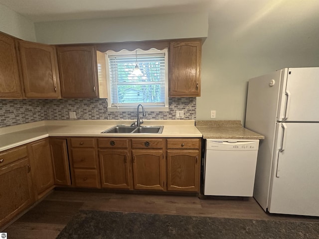 142 Forest Trl, Leroy, MI 49655 - kitchen with white appliances, a sink, dark wood-style flooring, and backsplash