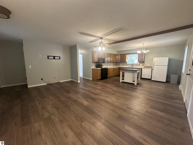 142 Forest Trl, Leroy, MI 49655 - kitchen with black appliances, open floor plan, dark wood finished floors, a chandelier, and decorative backsplash