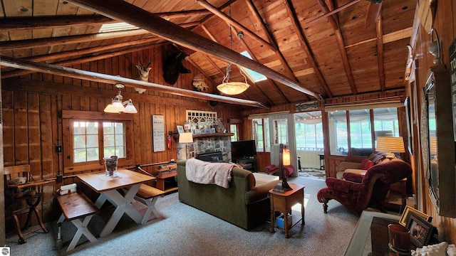 6875 Jose Lake Rd, South Branch, MI 48761 - living area featuring wood ceiling, wood walls, carpet flooring, and a fireplace