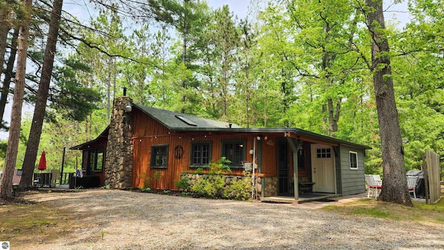 6875 Jose Lake Rd, South Branch, MI 48761 - view of front of property with a chimney and covered porch