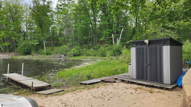 6875 Jose Lake Rd, South Branch, MI 48761 - view of yard with a boat dock and a water view