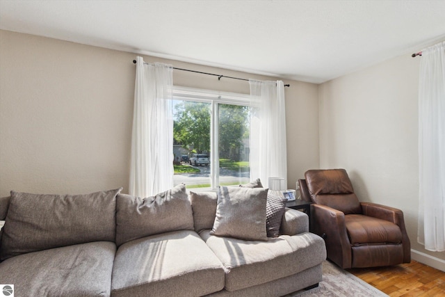 140 S State St, Alma, MI 48801 - living room featuring light wood-style flooring and baseboards