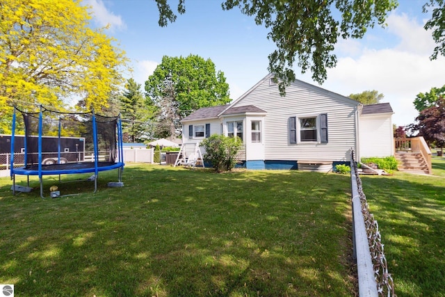 140 S State St, Alma, MI 48801 - rear view of property with a trampoline and stairs