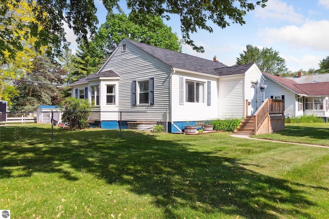 140 S State St, Alma, MI 48801 - back of property with a shingled roof and a chimney