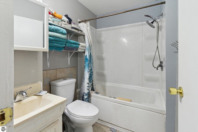 618 N River Ave, Alma, MI 48801 - bathroom with shower / tub combo, tile walls, vanity, and toilet