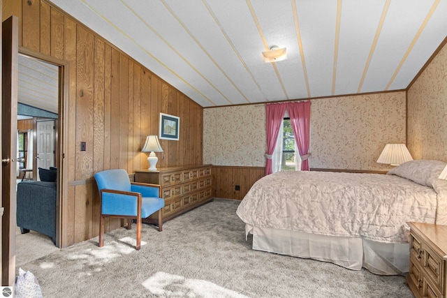 14501 Williams Dr, Elk Rapids, MI 49629 - carpeted bedroom with wooden walls and wallpapered walls