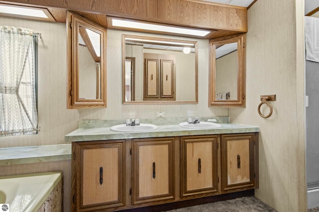 14501 Williams Dr, Elk Rapids, MI 49629 - bathroom featuring double vanity, a bathtub, and wallpapered walls
