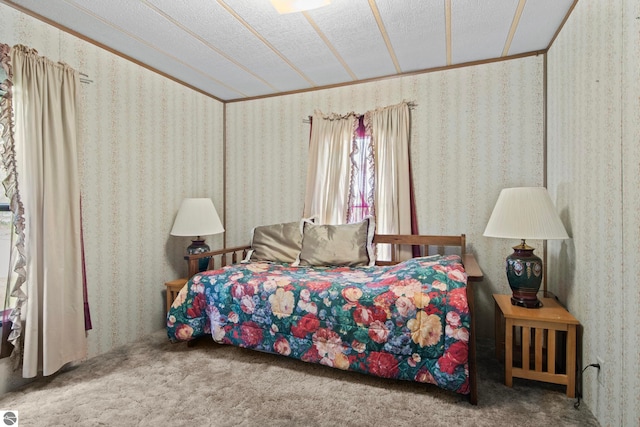 14501 Williams Dr, Elk Rapids, MI 49629 - bedroom with carpet floors, crown molding, and a textured ceiling
