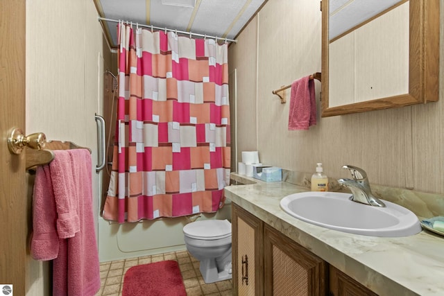 14501 Williams Dr, Elk Rapids, MI 49629 - full bathroom with vanity, toilet, and shower / tub combo with curtain