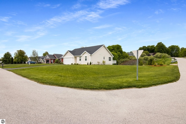 3171 Powder Horn Dr, Traverse City, MI 49685 - single story home featuring a garage and a front lawn