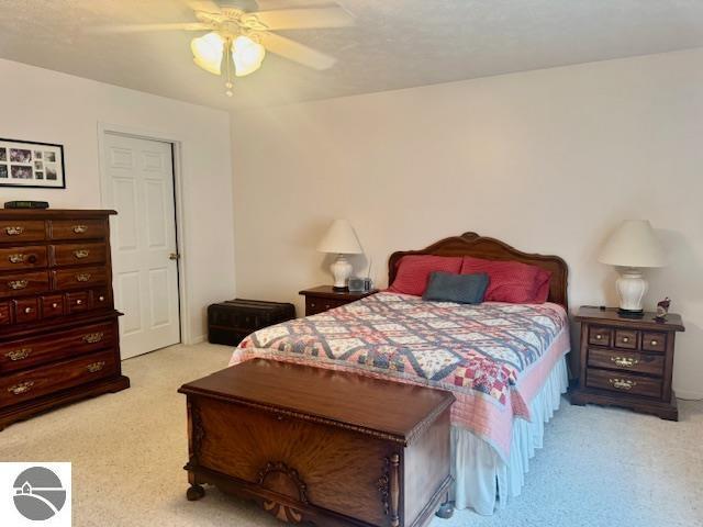 705 Eastgate Pl Unit 10 B, Traverse City, MI 49686 - bedroom featuring carpet flooring and ceiling fan