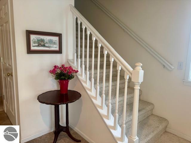 705 Eastgate Pl Unit 10 B, Traverse City, MI 49686 - stairs with baseboards