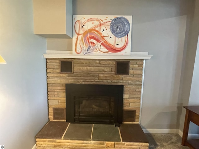 906 Vassar St, Alma, MI 48801 - detailed view of a stone fireplace and baseboards