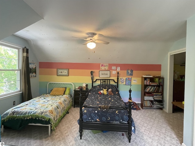 906 Vassar St, Alma, MI 48801 - carpeted bedroom featuring vaulted ceiling and ceiling fan