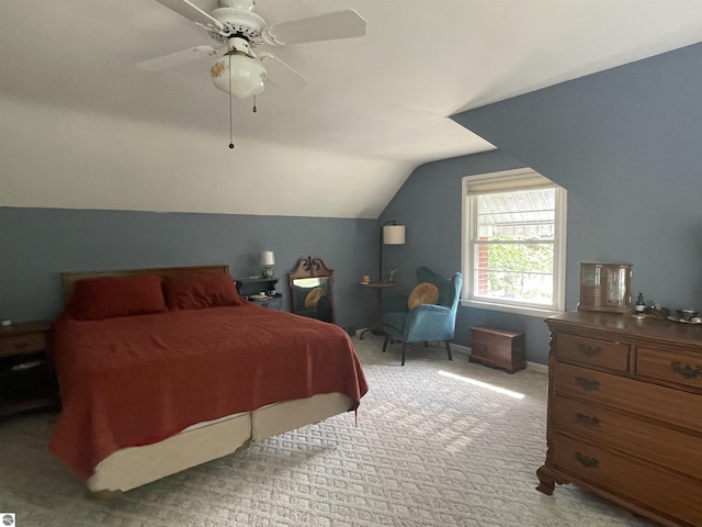 906 Vassar St, Alma, MI 48801 - carpeted bedroom with lofted ceiling and ceiling fan