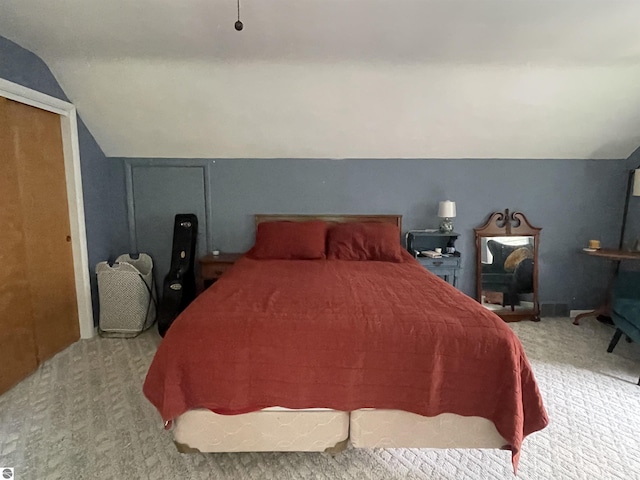 906 Vassar St, Alma, MI 48801 - bedroom with carpet and lofted ceiling