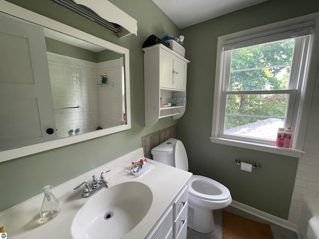 906 Vassar St, Alma, MI 48801 - full bathroom featuring toilet, healthy amount of natural light, a shower, and vanity