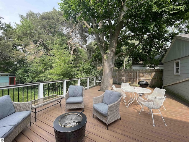 906 Vassar St, Alma, MI 48801 - wooden terrace featuring outdoor dining area