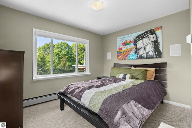 710 E Division St, Cadillac, MI 49601 - bedroom with a baseboard radiator, carpet, and baseboards