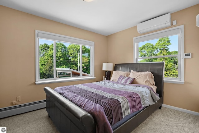 710 E Division St, Cadillac, MI 49601 - bedroom with a wall unit AC, a baseboard heating unit, carpet floors, and baseboards