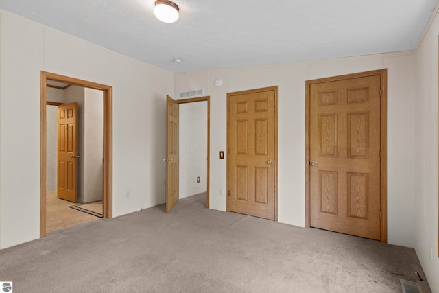 11748 NE Franklin St, Kalkaska, MI 49646 - unfurnished bedroom with carpet flooring