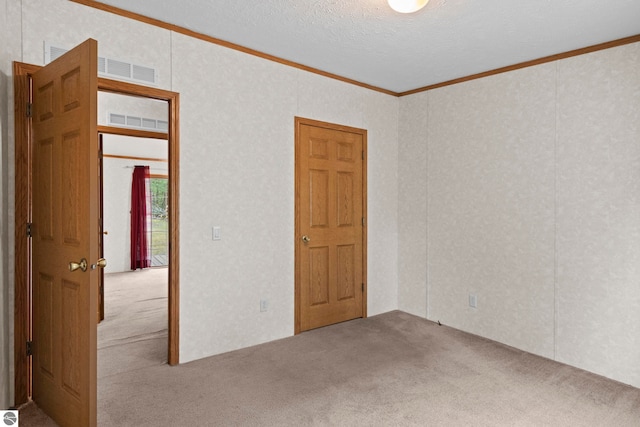 11748 NE Franklin St, Kalkaska, MI 49646 - carpeted empty room with crown molding