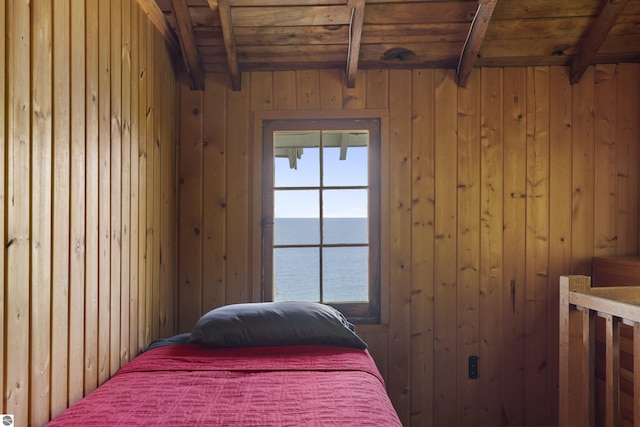 1884 Beech Rd, Frankfort, MI 49635 - bedroom with a water view, wooden walls, and wooden ceiling with exposed beams