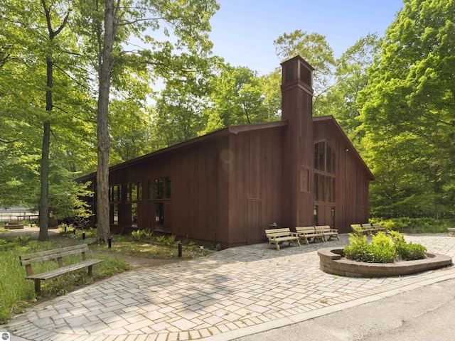 1884 Beech Rd, Frankfort, MI 49635 - view of home's exterior with a chimney