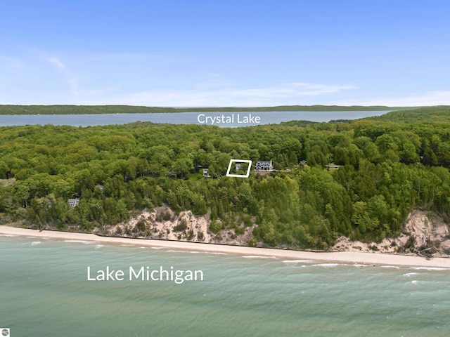 1884 Beech Rd, Frankfort, MI 49635 - aerial view of property's location featuring a heavily wooded area, a nearby body of water, and property parcel outlined