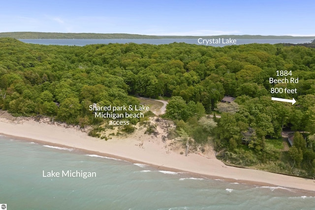 1884 Beech Rd, Frankfort, MI 49635 - drone / aerial view of waterfront with a beach and a heavily wooded area