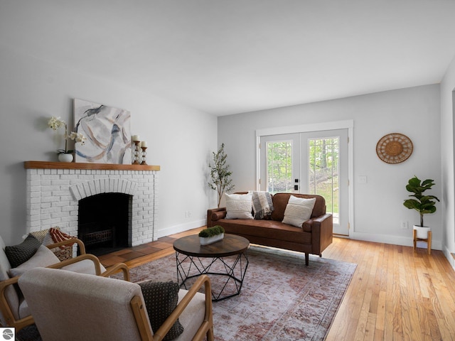 107 Hillcrest Ct, Traverse City, MI 49684 - living area with light wood-style floors, a fireplace, and baseboards