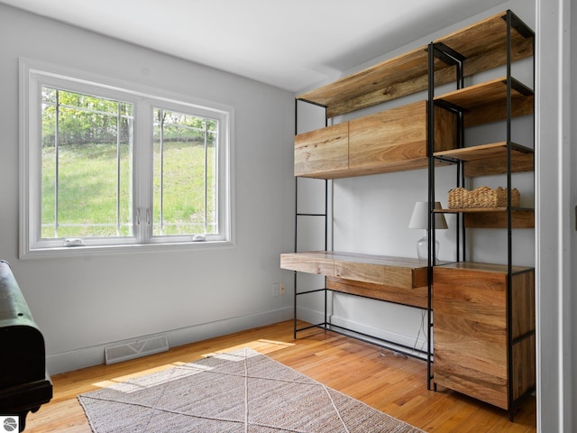 107 Hillcrest Ct, Traverse City, MI 49684 - unfurnished bedroom with light wood finished floors and baseboards