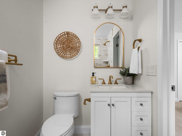 107 Hillcrest Ct, Traverse City, MI 49684 - bathroom featuring vanity, toilet, and baseboards