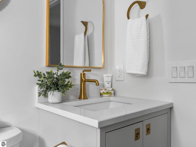 107 Hillcrest Ct, Traverse City, MI 49684 - half bathroom featuring vanity and toilet