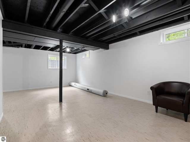 107 Hillcrest Ct, Traverse City, MI 49684 - below grade area featuring baseboards and tile patterned floors