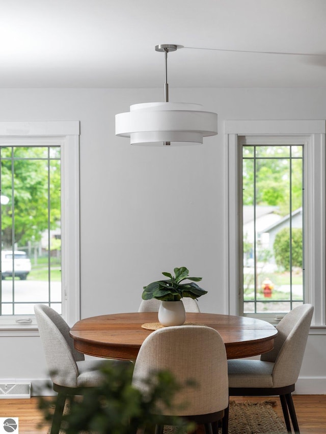 107 Hillcrest Ct, Traverse City, MI 49684 - dining space featuring plenty of natural light, wood finished floors, and baseboards