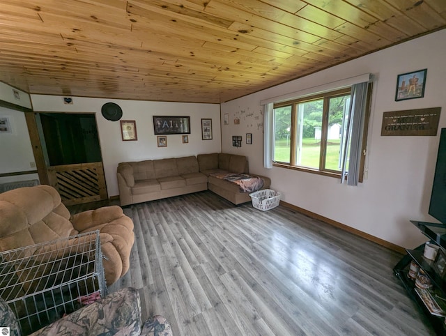 205 Fannie St, Au Gres, MI 48703 - living room featuring wood ceiling, wood finished floors, and baseboards