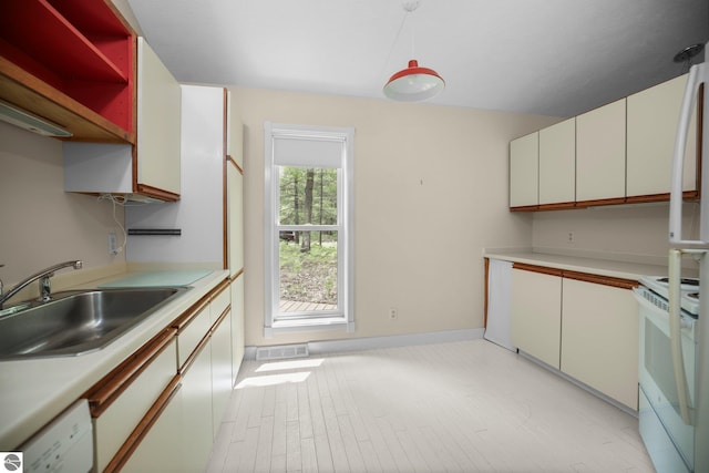 1631 Melody Ln, Interlochen, MI 49643 - kitchen featuring white appliances, a sink, light countertops, and white cabinetry