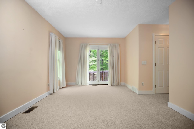 1631 Melody Ln, Interlochen, MI 49643 - carpeted empty room with baseboards