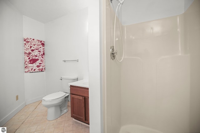 1631 Melody Ln, Interlochen, MI 49643 - full bath featuring a stall shower, toilet, tile patterned floors, vanity, and baseboards