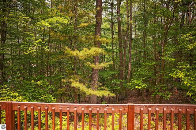 1631 Melody Ln, Interlochen, MI 49643 - wooden deck with a forest view